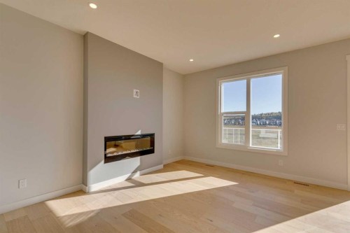 143 Creekstone Green Sw, Calgary, AB - Indoor With Fireplace