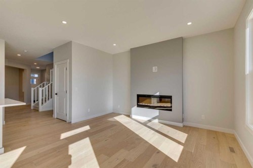 143 Creekstone Green Sw, Calgary, AB - Indoor With Fireplace