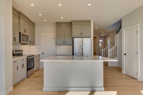 143 Creekstone Green Sw, Calgary, AB - Indoor Photo Showing Kitchen With Upgraded Kitchen