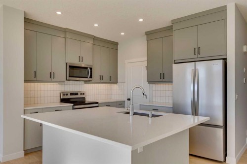 143 Creekstone Green Sw, Calgary, AB - Indoor Photo Showing Kitchen With Upgraded Kitchen