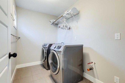 75 Masters Rise Se, Calgary, AB - Indoor Photo Showing Laundry Room