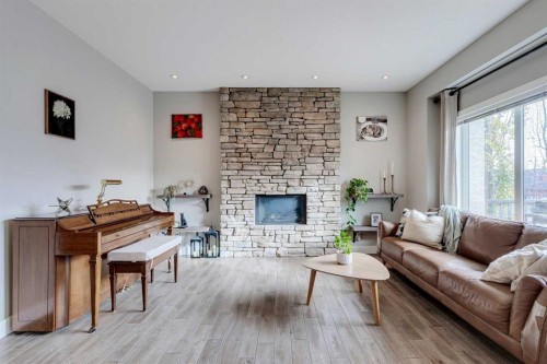 75 Masters Rise Se, Calgary, AB - Indoor Photo Showing Living Room With Fireplace