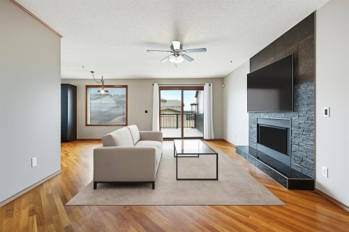 128 Ventura Way Ne, Calgary, AB - Indoor Photo Showing Living Room With Fireplace