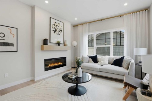 64 Buffaloberry Manor Se, Calgary, AB - Indoor Photo Showing Living Room With Fireplace