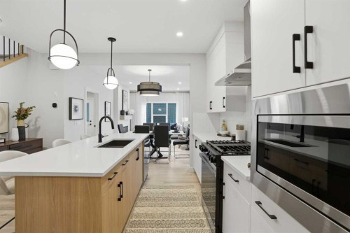 64 Buffaloberry Manor Se, Calgary, AB - Indoor Photo Showing Kitchen With Upgraded Kitchen