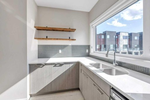 903-218 Sherwood Square Nw, Calgary, AB - Indoor Photo Showing Kitchen With Double Sink