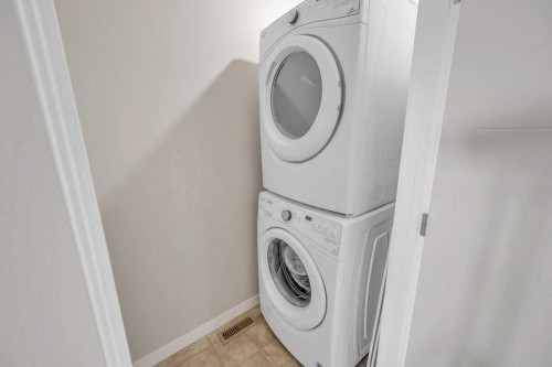 903-218 Sherwood Square Nw, Calgary, AB - Indoor Photo Showing Laundry Room