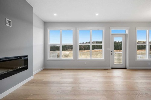 76 Creekview Manor Sw, Calgary, AB - Indoor Photo Showing Living Room With Fireplace