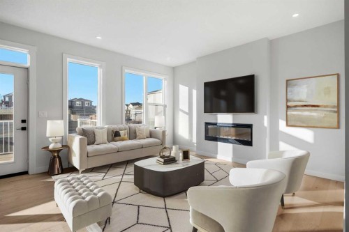 63 Creekstone Common Sw, Calgary, AB - Indoor Photo Showing Living Room With Fireplace