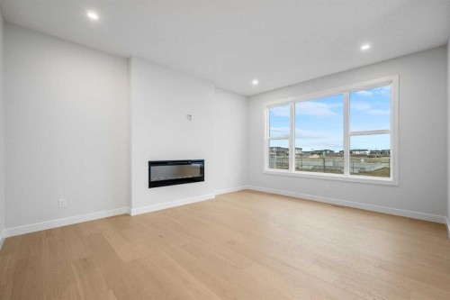 56 Creekstone Grove Sw, Calgary, AB - Indoor Photo Showing Living Room With Fireplace