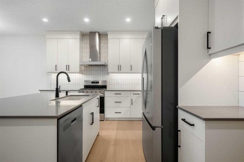 56 Creekstone Grove Sw, Calgary, AB - Indoor Photo Showing Kitchen With Upgraded Kitchen