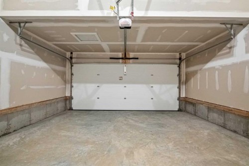 56 Creekstone Grove Sw, Calgary, AB - Indoor Photo Showing Garage