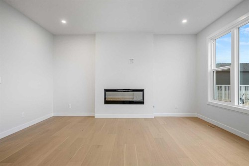 56 Creekstone Grove Sw, Calgary, AB - Indoor With Fireplace