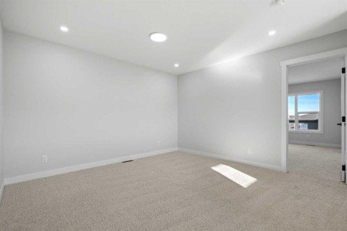 38 Amblefield Common Nw, Calgary, AB - Indoor Photo Showing Other Room