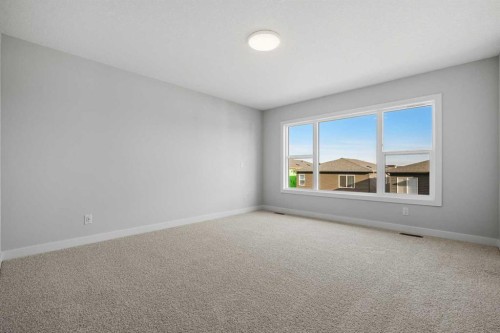 38 Amblefield Common Nw, Calgary, AB - Indoor Photo Showing Other Room