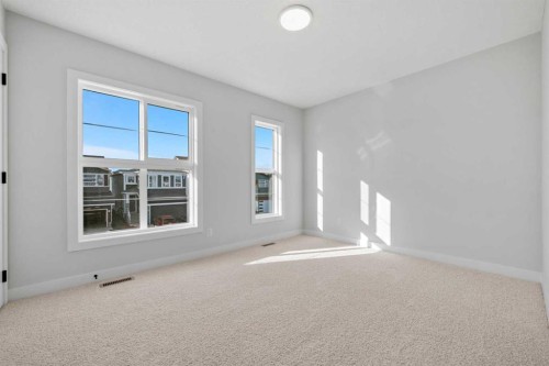 38 Amblefield Common Nw, Calgary, AB - Indoor Photo Showing Other Room