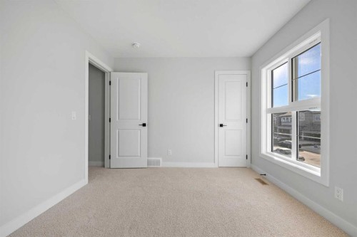 38 Amblefield Common Nw, Calgary, AB - Indoor Photo Showing Other Room