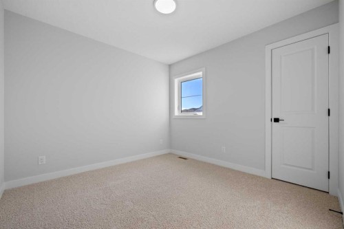 38 Amblefield Common Nw, Calgary, AB - Indoor Photo Showing Other Room