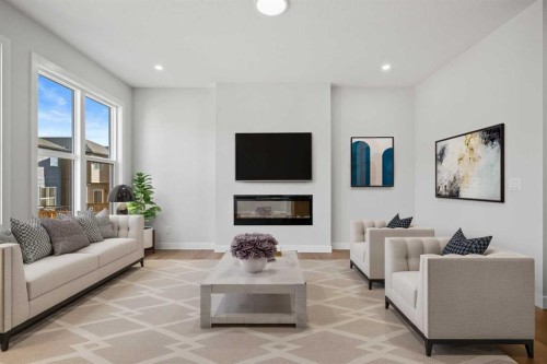38 Amblefield Common Nw, Calgary, AB - Indoor Photo Showing Living Room With Fireplace
