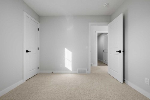 38 Amblefield Common Nw, Calgary, AB - Indoor Photo Showing Other Room