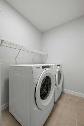 38 Amblefield Common Nw, Calgary, AB - Indoor Photo Showing Laundry Room