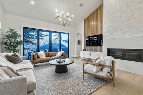 56 Lissington Drive Sw, Calgary, AB - Indoor Photo Showing Living Room With Fireplace