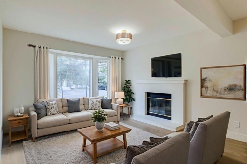 246 Cedarwood Park Sw, Calgary, AB - Indoor Photo Showing Living Room With Fireplace