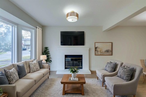 246 Cedarwood Park Sw, Calgary, AB - Indoor Photo Showing Living Room With Fireplace