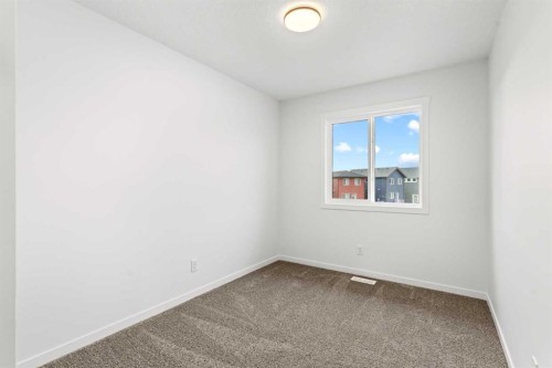 918 Creekside Boulevard Sw, Calgary, AB - Indoor Photo Showing Other Room