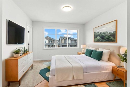 918 Creekside Boulevard Sw, Calgary, AB - Indoor Photo Showing Bedroom
