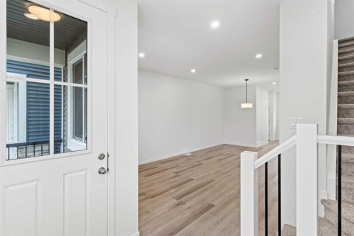 918 Creekside Boulevard Sw, Calgary, AB - Indoor Photo Showing Other Room