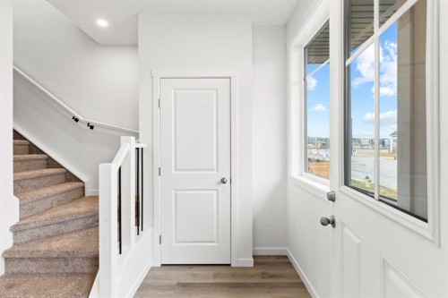 918 Creekside Boulevard Sw, Calgary, AB - Indoor Photo Showing Other Room