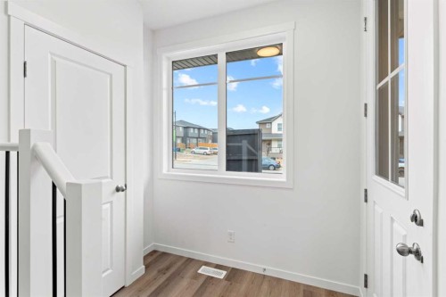 918 Creekside Boulevard Sw, Calgary, AB - Indoor Photo Showing Other Room