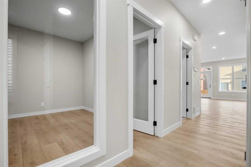 62 Amblefield Common Nw, Calgary, AB - Indoor Photo Showing Other Room