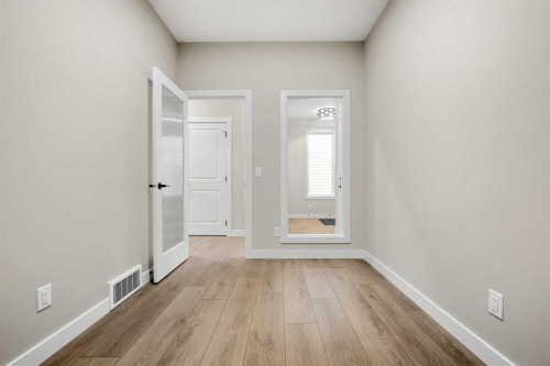 62 Amblefield Common Nw, Calgary, AB - Indoor Photo Showing Other Room