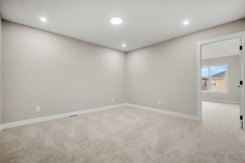 62 Amblefield Common Nw, Calgary, AB - Indoor Photo Showing Other Room