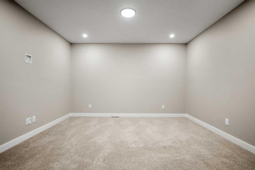 62 Amblefield Common Nw, Calgary, AB - Indoor Photo Showing Other Room