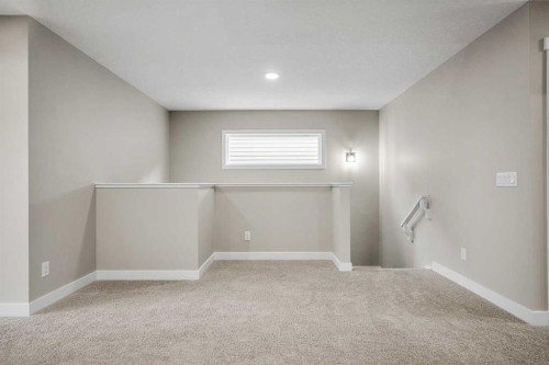 62 Amblefield Common Nw, Calgary, AB - Indoor Photo Showing Other Room