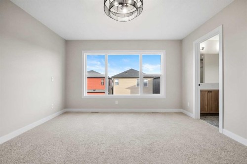 62 Amblefield Common Nw, Calgary, AB - Indoor Photo Showing Other Room