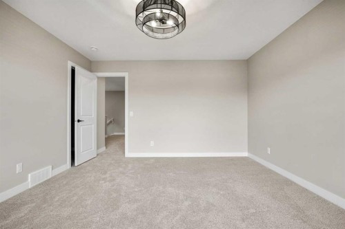 62 Amblefield Common Nw, Calgary, AB - Indoor Photo Showing Other Room