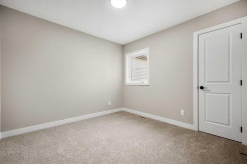 62 Amblefield Common Nw, Calgary, AB - Indoor Photo Showing Other Room