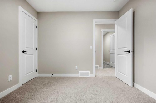 62 Amblefield Common Nw, Calgary, AB - Indoor Photo Showing Other Room