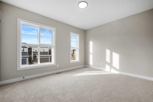 62 Amblefield Common Nw, Calgary, AB - Indoor Photo Showing Other Room