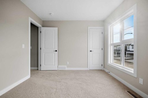 62 Amblefield Common Nw, Calgary, AB - Indoor Photo Showing Other Room