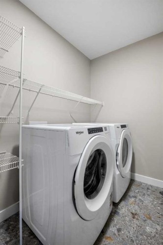 62 Amblefield Common Nw, Calgary, AB - Indoor Photo Showing Laundry Room