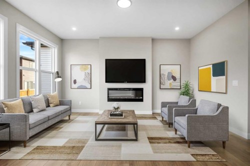 62 Amblefield Common Nw, Calgary, AB - Indoor Photo Showing Living Room With Fireplace