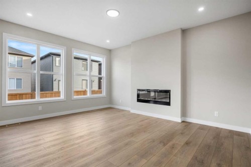 62 Amblefield Common Nw, Calgary, AB - Indoor With Fireplace