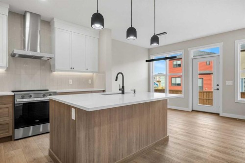 62 Amblefield Common Nw, Calgary, AB - Indoor Photo Showing Kitchen With Upgraded Kitchen