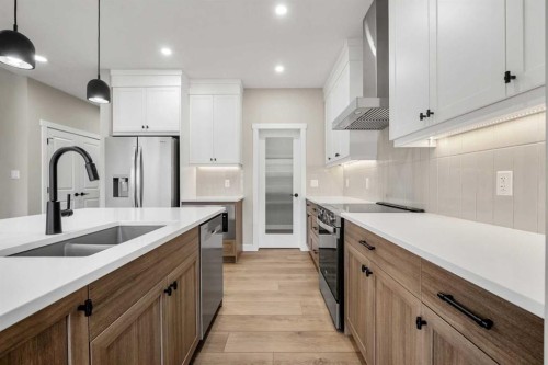 62 Amblefield Common Nw, Calgary, AB - Indoor Photo Showing Kitchen With Double Sink With Upgraded Kitchen