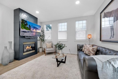 12-10 St Julien Drive Sw, Calgary, AB - Indoor Photo Showing Living Room With Fireplace